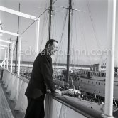 John Wayne on board Onassis' yacht Christina. Monaco harbor 1955. - Photo by Edward Quinn