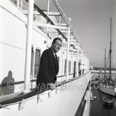 John Wayne on board Onassis' yacht Christina. Monaco harbor 1955. - Photo by Edward Quinn
