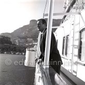 John Wayne on board Onassis' yacht Christina. Monaco harbor 1955. - Photo by Edward Quinn
