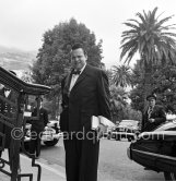 Orson Welles in front of the Casino in Monte Carlo. Welles came to the Riviera to present his film "Othello" at the Cannes Film Festival. He received the "Palme d’Or" for the film. The film, at present a "classique", was vilified by most of the critics. Monte Carlo 1952. - Photo by Edward Quinn
