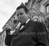 Orson Welles in front of the Casino in Monte Carlo. Welles came to the Riviera to present his film "Othello" at the Cannes Film Festival. He received the "Palme d’Or" for the film. The film, at present a "classique", was vilified by most of the critics. Monte Carlo 1952. - Photo by Edward Quinn