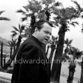 Orson Welles in front of the Casino in Monte Carlo. Welles came to the Riviera to present his film "Othello" at the Cannes Film Festival. He received the "Palme d’Or" for the film. The film, at present a "classique", was vilified by most of the critics. Monte Carlo 1952. - Photo by Edward Quinn