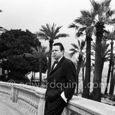 Orson Welles in front of the Casino in Monte Carlo. Welles came to the Riviera to present his film "Othello" at the Cannes Film Festival. He received the "Palme d’Or" for the film. The film, at present a "classique", was vilified by most of the critics. Monte Carlo 1952. - Photo by Edward Quinn