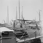 Jimmy Donahue, a heir to the Woolworth estate, and Wallis Simpson, Duchess of Windsor, getting on board yacht Olnico. Although openly gay, Donahue claimed he had a four-year affair with the Duchess. Cannes 1951 - Photo by Edward Quinn