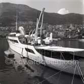 Onassis' yacht Christina with Italian twin-engine amphibian flying boat G-AOFN Piaggio P.136-L2 C/N 195. Monaco harbor about 1955. - Photo by Edward Quinn