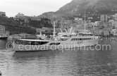 Onassis' yacht Christina with Italian twin-engine amphibian flying boat G-APNY Piaggio P-136L SERIES 2 C/N 242. Monaco harbor with the palais in the background 1955. - Photo by Edward Quinn