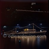 Yacht Christina of Aristotle Onassis lit up in harbor. Monaco 1954. - Photo by Edward Quinn