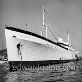 Yacht Moineau of La Môme Moineau (the kid sparrow), "the richest woman of the Côte d'Azur", former flower seller, married to husband Mr. Benítez-Rexach, Puerto Rican ship building millionaire. The ship was the 92 m US Navy frigate Natchez of 1942, converted into the personal yacht Moineau, scrapped 1959. Cannes harbor  1954. https://www.superyachttimes.com/yacht-news/yachts-owned-by-felix-and-lucien-benitez-rexach - Photo by Edward Quinn